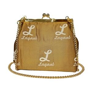 Handmade bag from jacquard fabric with woven white logo.